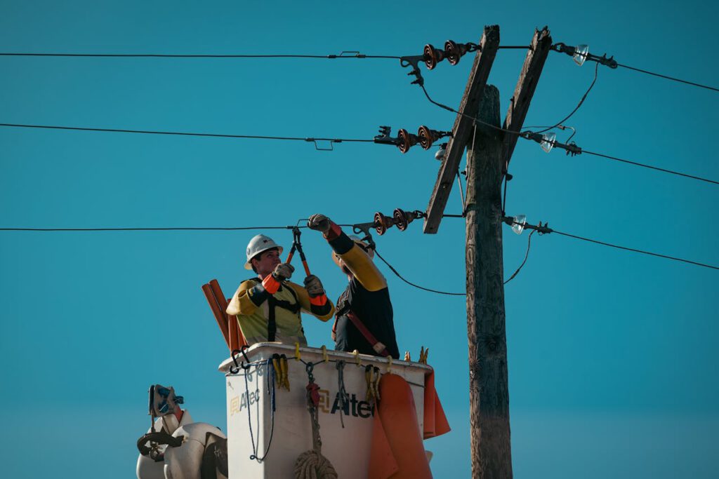zipwp-image-10130754 Electricians Fixing the Electric Lines